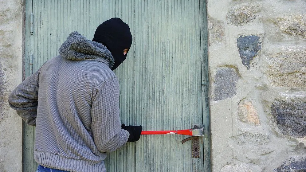 A burglar breaking in